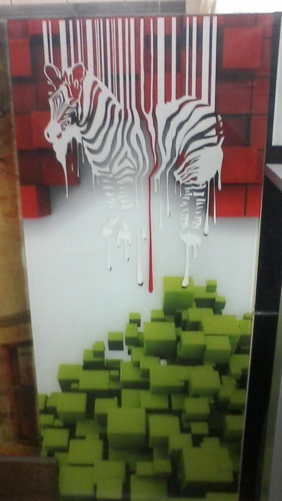 A decorative panel combining zebra imagery, red accents, and green geometric forms.